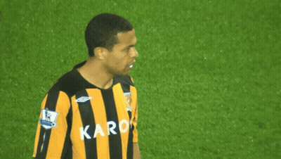 Man In Black And Yellow Striped Shirt With Karo GIF