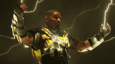 Man In Black And Yellow Suit Surrounded By Lightning Bolts GIF