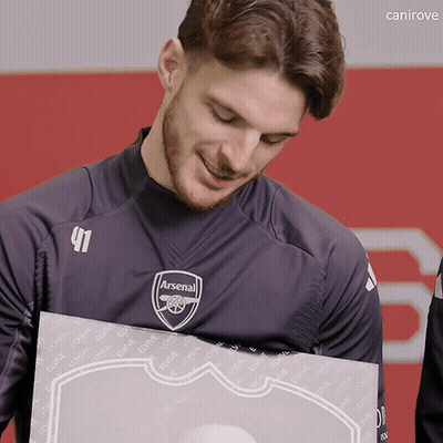Man In Black Arsenal Shirt Holding Box GIF