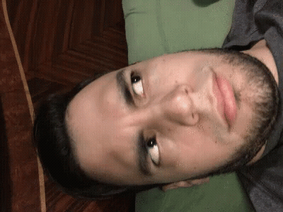 Man In Black Balenciaga Shirt On Couch GIF