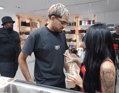 Man In Black Balenciaga Shirt Talks To Woman In Red Bra GIF