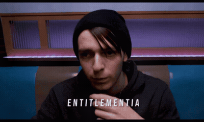 Man In Black Beanie And Black Hoodie With Word Entitlementia GIF