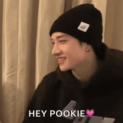 Man In Black Beanie And Hoodie Saying Hey Pookie GIF