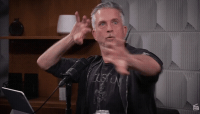 Man In Black Boston Shirt Gesturing GIF