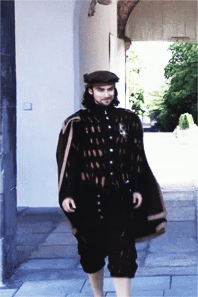 Man In Black Cape And Hat Walking GIF