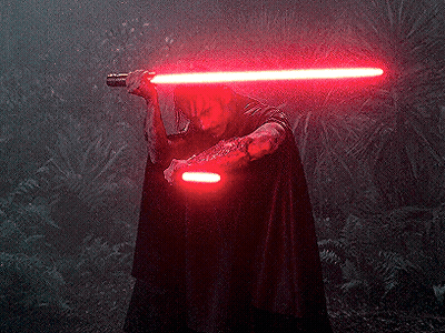 Man in Black Cape Holding Red Lightsaber