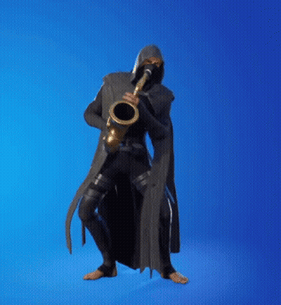 Man In Black Cape Playing Saxophone GIF