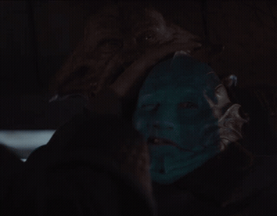 Man In Black Cape Standing In Doorway GIF