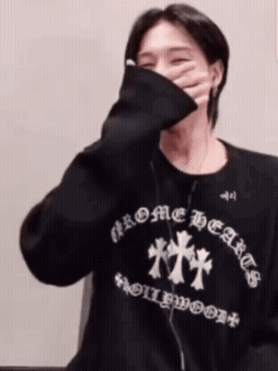 Man In Black Chrome Hearts Sweatshirt Covering Face GIF
