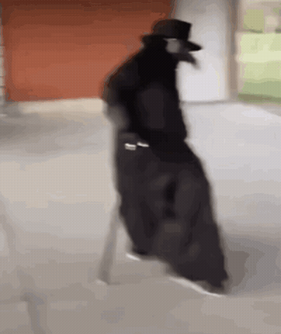 Man In Black Coat And Top Hat On White Chair GIF