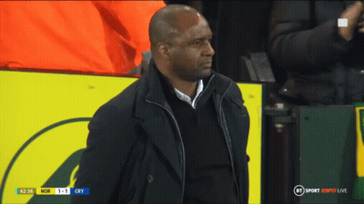 Man In Black Coat In Front Of BT Sport ESPN Sign GIF