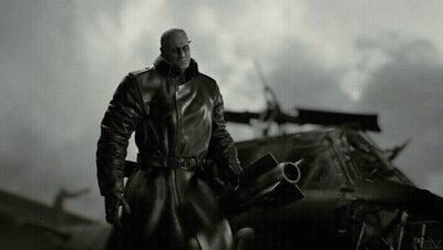 Man In Black Coat In Front Of Military Vehicle GIF