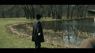 Man In Black Coat Near Lake GIF