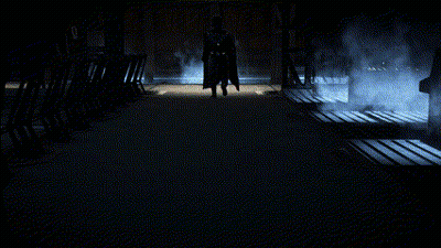 Man in Black Coat Walking in Dark