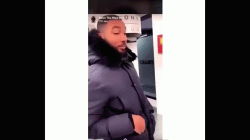 Man In Black Coat With Fur Hood GIF