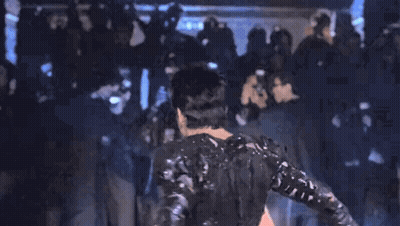 Man In Black Costume Blue Background GIF
