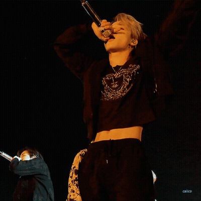 Man In Black Crop Top Singing Into Microphone GIF