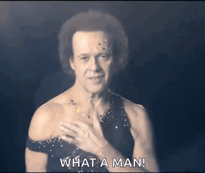 Man In Black Dress Asking What A Man Is GIF