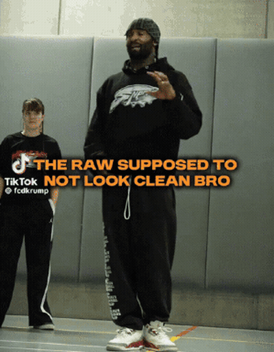 Man In Black Eagles Hoodie With TikTok Logo GIF