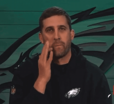 Man In Black Eagles Sweatshirt Wiping Face GIF