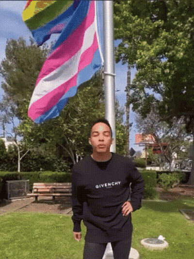 Man In Black Givenchy Sweatshirt With Rainbow Flag GIF