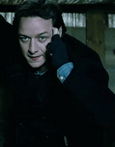 Man In Black Gloves Holding Hand To Ear GIF