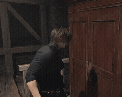 Man In Black Gloves Reaching Into Shelf GIF