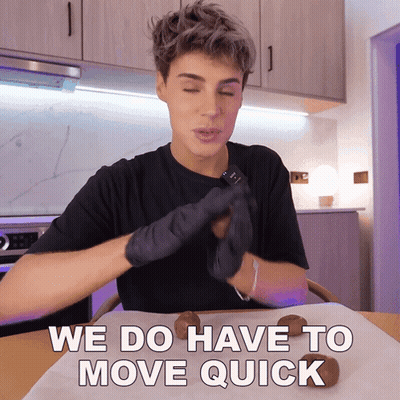 Man In Black Gloves Sitting At Table We Do Have To Move Quick GIF