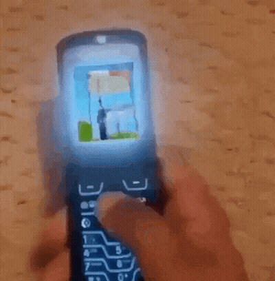 Man In Black Guess Jacket Looking At Phone GIF