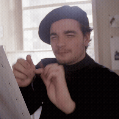 Man In Black Hat And Black Turtleneck GIF