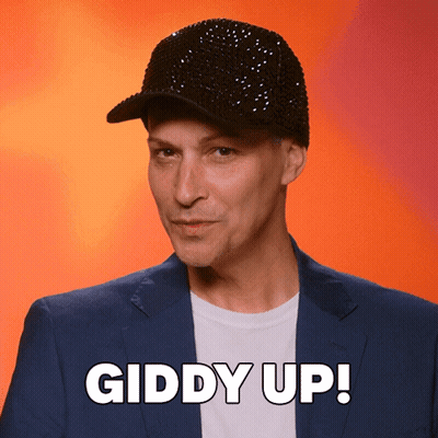 Man In Black Hat And Blue Suit Says Giddy Up GIF