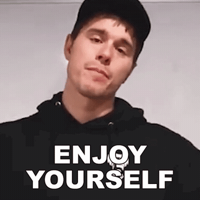 Man In Black Hat And Hoodie Saying Enjoy Yourself GIF