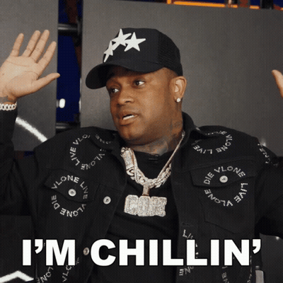 Man In Black Hat And Jacket Saying I'm Chillin GIF