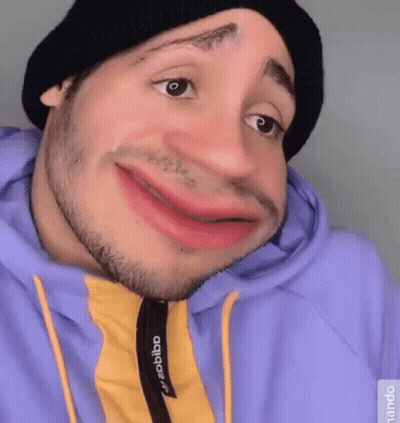 Man In Black Hat And Purple Hoodie Making Funny Face GIF