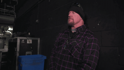 Man In Black Hat And Purple Plaid Shirt GIF