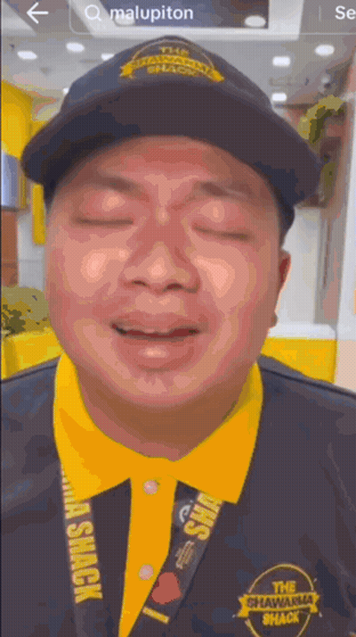 Man In Black Hat And Yellow Shawarma Shack Shirt GIF