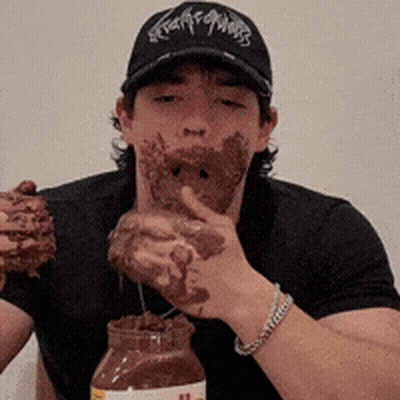 Man In Black Hat Eating Nutella GIF