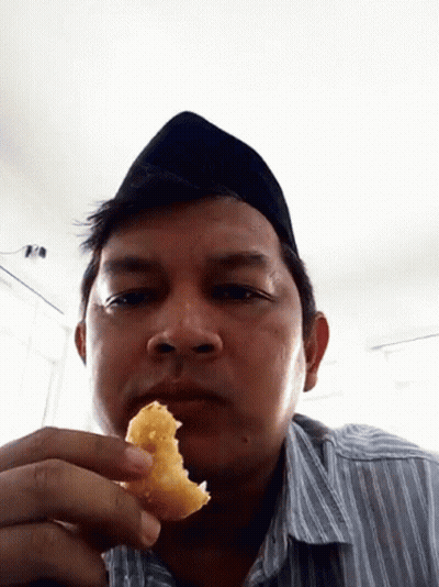 Man In Black Hat Holding Food GIF