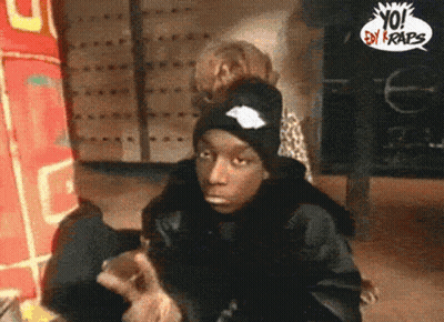 Man In Black Hat In Front Of Yo! By Crabs Sign GIF