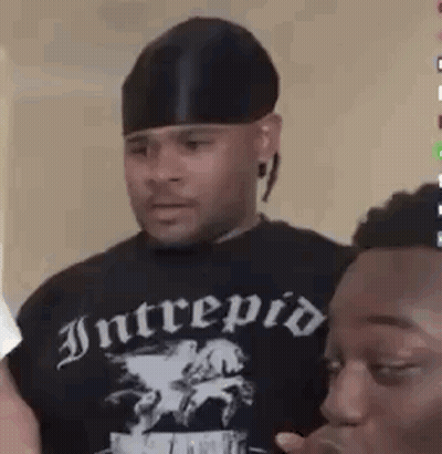 Man In Black Hat Next To Man In Black Shirt GIF