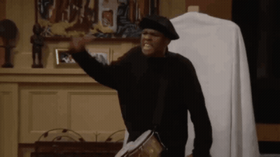 Man In Black Hat Playing Drum Making Funny Face GIF