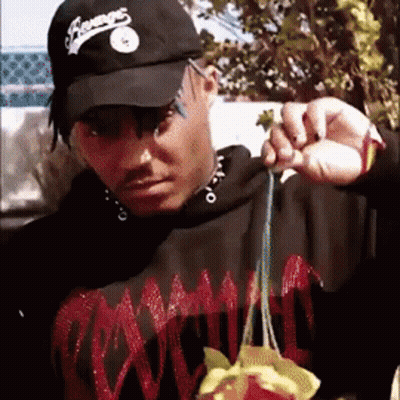 Man In Black Hat Saying Champs Holding Something GIF