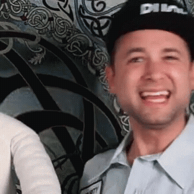 Man In Black Hat Saying Dime Smiling GIF