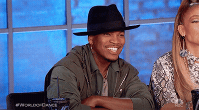 Man In Black Hat Smiling Next To Woman GIF