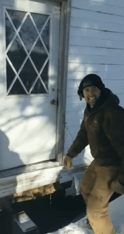 Man In Black Hat Standing In Front Of White Door GIF