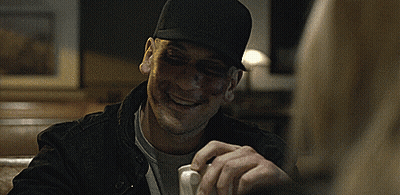 Man In Black Hat With Black Eye And Nose GIF