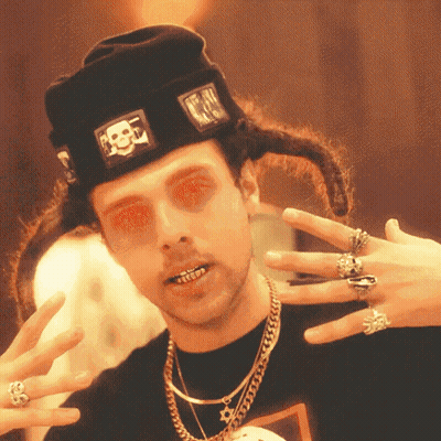 Man In Black Hat With Skull And Rings GIF