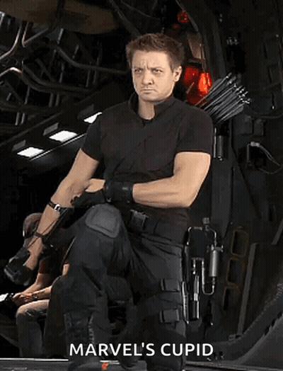 Man In Black Holding Bow Saying Marvel's Cupid GIF