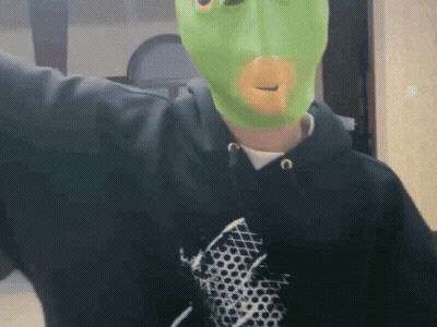 Man In Black Hoodie And Green Mask GIF