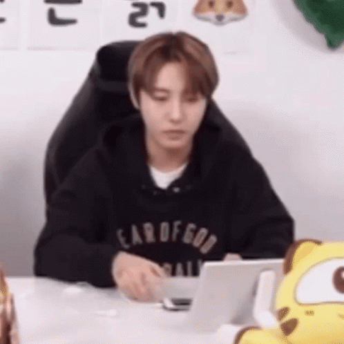 Man In Black Hoodie At Desk With Laptop GIF